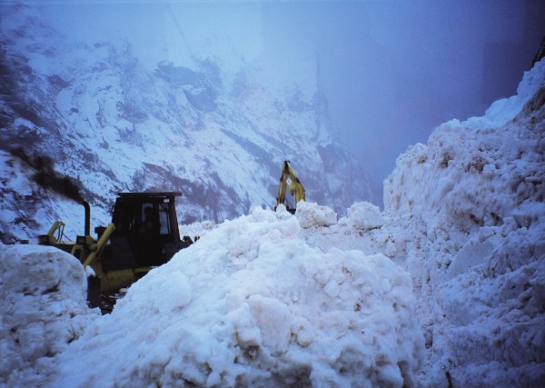 55_Milford_02 Cold temperatures, steep mountains and an annual rainfall of the order of seven metres are an ideal recipe for avalanches, a greater hazard on the Milford road than on any other in the country. Heavy machinery is needed to clear avalanche debris in an effort to keep the road open.